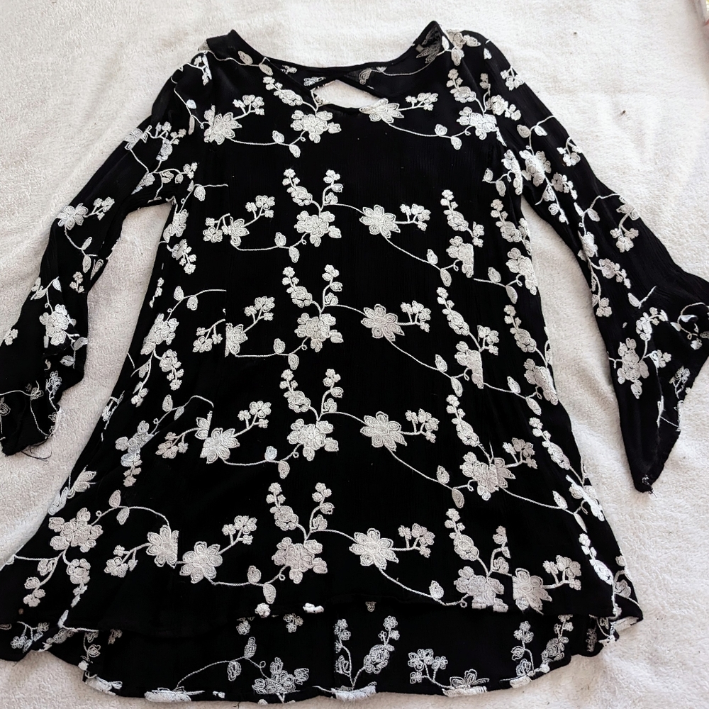 Flowy Black and White Embroidery Top with peek-a-boo back by Cheeky Boutique.